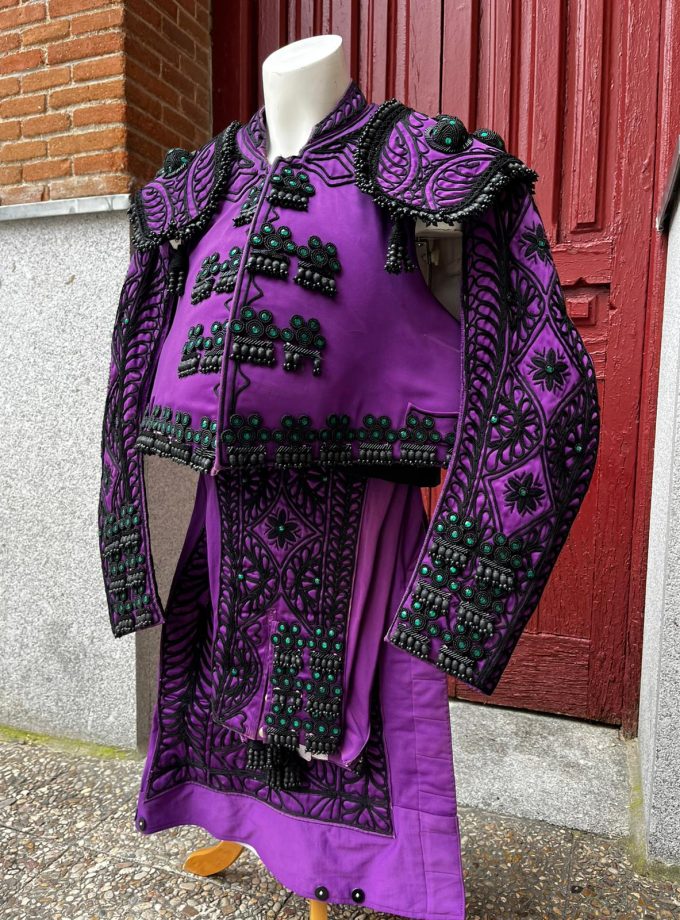 Nazareno and jet bullfighter's suit with green beadwork